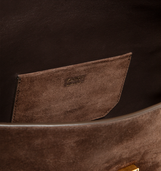 Image 3 of 3 - BROWN - Khaite Audrey flap-front clutch that combines refined lines with soft curves in velvety suede. Art Deco-inspired hardware at magnetic closure. Internal card pocket. Suede calfskin (100% calfskin). Made in Italy. 