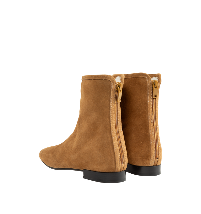 Image 3 of 4 - NEUTRAL - Toteme Women's Shearling-Lined Suede Ankle Boots are crafted from lamb suede and feature a streamlined ankle boot silhouette with a modern square toe and fold-over uppers. Designed for cold-weather wear, this refined style is enhanced by a plush shearling lining and trim, combining warmth with Toteme's signature minimalist aesthetic. Main Material: Lamb Leather Suede. Lining: Shearling. Trim: Shearling. Insole: Leather. Sole: Rubber. Includes: Shoe Box, Dust Bag. Made in Italy. 