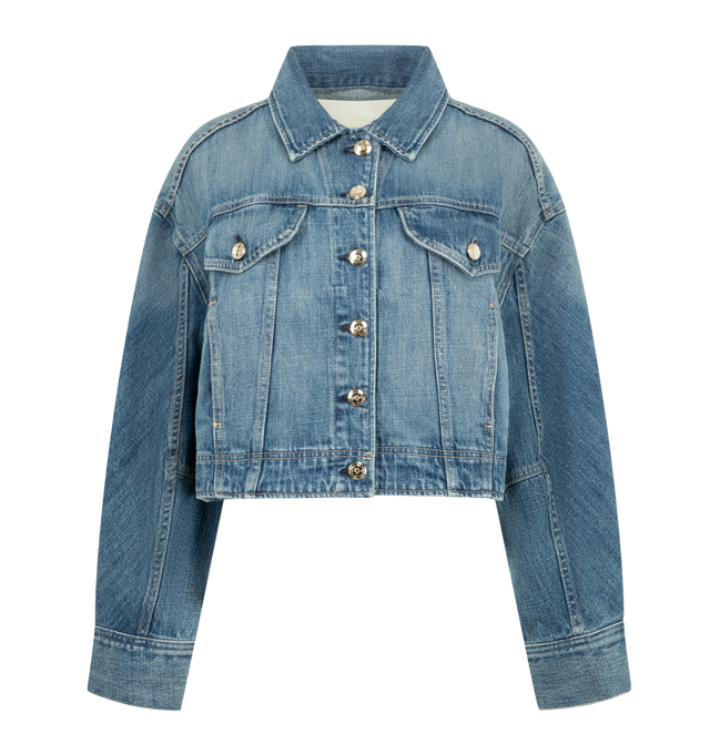 Image 1 of 3 - BLUE - Ruadh Women's Mhor Jacket is handcrafted from rigid regenerative cotton with a subtle cross-hatch texture that softens with wear for enhanced comfort. Designed with a bias-cut sleeve panel, this denim jacket creates an organic, flattering silhouette while maintaining a structured feel. Finished with the brand's signature semi-precious gold-tone hardware. Main Material: 100% Regenerative Cotton. Signature Gold-Tone Hardware. Made in USA. 