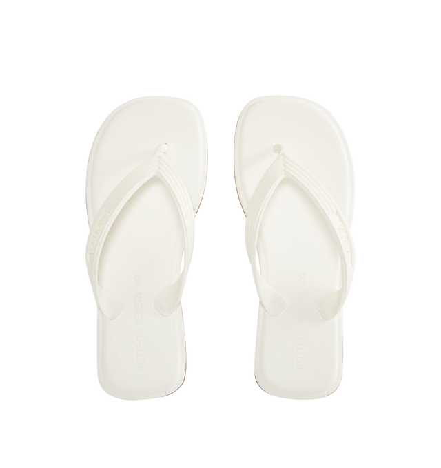 Image 4 of 4 - WHITE - BOTTEGA VENETA Sampieri Thong featuring rubber thong sandal with leather insole. Lining: lambskin. Rubber-injected leather outsole. Thermoplastic polyurethane. Made in Italy.  