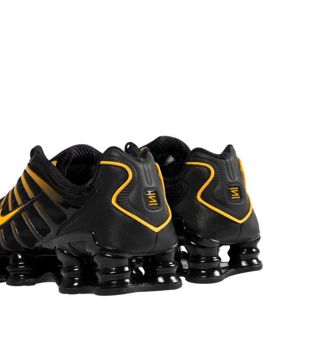 Image 3 of 5 - BLACK - NIKE Shox TL Sneaker featuring Nike Shox technology, a combination upper with a full TPU cage, molded overlays throughout the midfoot, a TPU plate in the heel between the midsole and Nike Shox technology, foam midsole for lightweight cushioning, non-marking, solid rubber in a modified waffle outsole and synthetic and textile upper. 