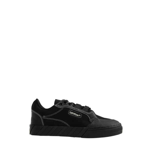 Image 1 of 5 - BLACK - Off-White Vulcanized 779 Sneakers are a lace-up style with leather uppers, diag striped rubber soles, logo boxes at the sides, and stitched arrow logos at the heels. 100% leather.  