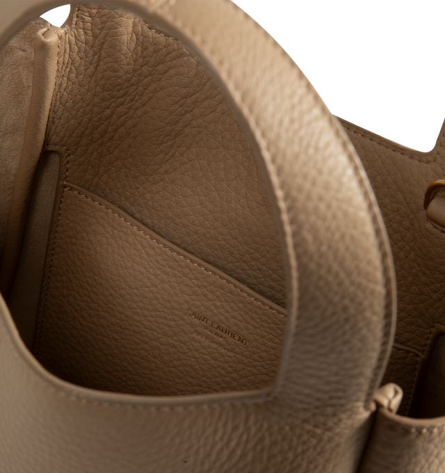 Image 3 of 3 - NEUTRAL - Saint Laurent Women's Le 5  7 Baby Bea Bag is crafted from deerskin and features the signature CASSANDRE hook closure, bronze-tone hardware, and a tonal suede lining. A compact interpretation of the iconic Le 5  7 Bea silhouette, this versatile bag can be carried by hand with the top handle or worn crossbody with the adjustable and detachable strap. Dimensions: 18 x 15 x 13 cm / 7.1 x 5.9 x 5.1 in. Handle Drop: 10 cm / 3.9 in. Strap Drop: 55.5 cm / 21.9 in. Fits a large phone, card  