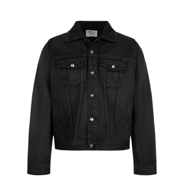Image 1 of 3 - BLACK - Midnight Rodeo Waxed Essential Denim Trucker is crafted from cotton denim and features a structured trucker silhouette with a waxed coating that creates a dry luster inspired by mesquite and iron-clay desert tones. Designed with a spread collar, front button closure, chest flap pockets, front welt pockets, button cuffs, and adjustable button side tabs, this cropped jacket balances heritage workwear details with a modern, architectural shape. Main Material: Cotton.  