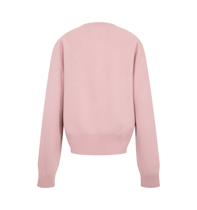 Image 2 of 2 - PINK - Extreme Cashmere Women's Luce Cardigan is crafted from cashmere and features a classic crew neckline, eight corozo button closures, and a comfort fit with dropped shoulders. Designed with a relaxed silhouette, this knit is finished with ribbed cuffs, hem, and neckline for added structure. Main Material: 88% Cashmere, 10% Nylon, 2% Elastane.  
