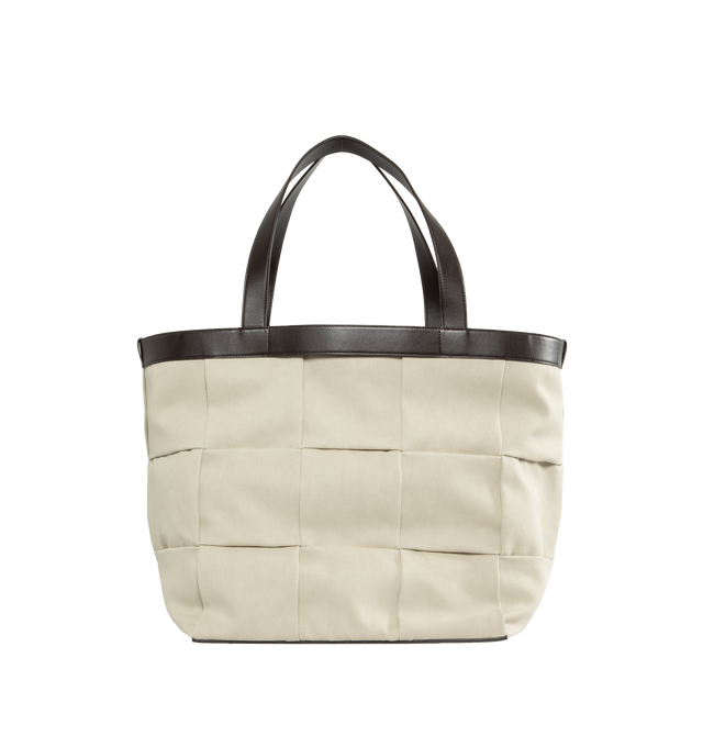 Image 1 of 3 - WHITE - BOTTEGA VENETA Canvas Tote featuring smooth canvas in intrecciato-pattern weave, leather handles, interior has one zip pocket and two open pockets and buckle closure. Canvas and leather. Made in Italy. 