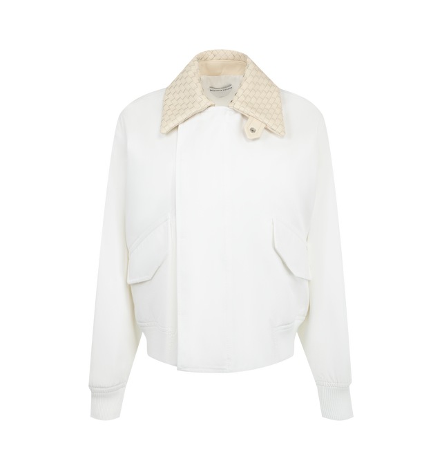 Image 1 of 3 - WHITE - Bottega Veneta Women's Cotton Blouson is crafted from lightweight water-repellent cotton and features a relaxed silhouette with an Intrecciato leather collar, a detachable Intrecciato leather throat latch, and a zip-and-button front closure. Fully lined for added comfort, this designer jacket combines signature Bottega Veneta craftsmanship with functional outerwear details, creating a refined everyday layering piece. Main Material: 100% Cotton. Made in Italy. 