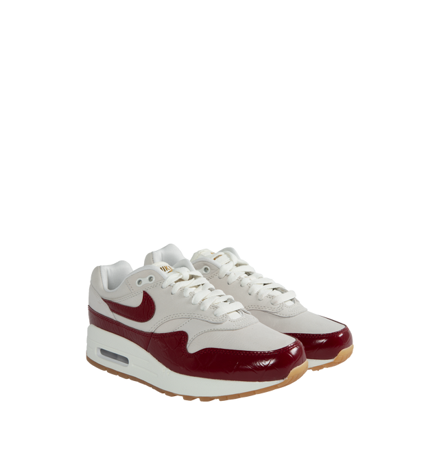 Image 2 of 5 - RED - NIKE Air Max 1 LX featuring classic wavy mudguard, foam midsole, Max Air unit in the heel, rubber waffle outsole and padded, low-cut collar. 