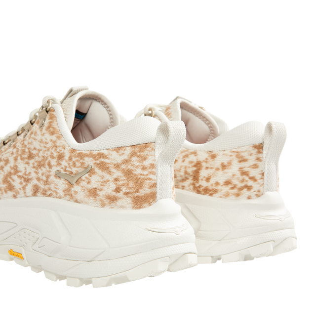 Image 3 of 5 - WHITE - HOKA  Tor Summit+ Pony Hair Sneaker featuring pony hair leather upper, metal eyelets + hiking-style lacing system, Vibram Megagrip outsole for traction on varied terrain, cushioned midsole for long-wear comfort, pull tabs at heel and tongue for easy entry and ;ow-cut hiking silhouette. 