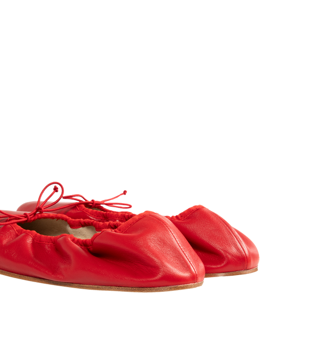 Image 3 of 4 - RED - The Row Classic ballet flat in smooth nappa leather with grosgrain piping, adjustable elastic tie, and flexible leather sole. 100% Lambskin Leather with leather sole. Made in Italy. 