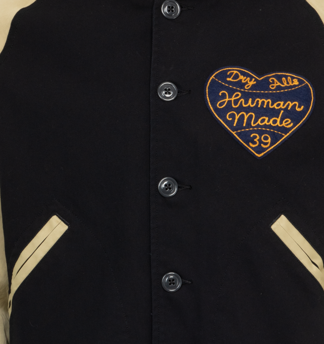 Image 3 of 4 - NAVY - HUMAN MADE Baseball Jacket featuring ribbed collar, cuffs and hem, button front closure, two front pockets and logo on front and back. 100% cotton.  