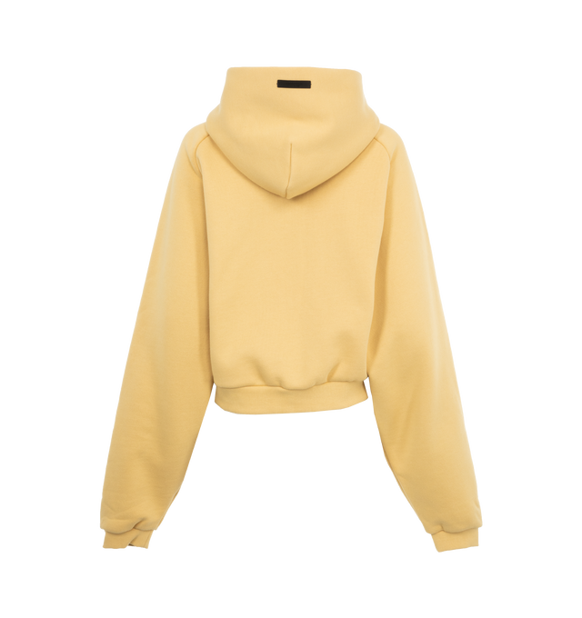 Image 2 of 2 - YELLOW - Fear of God Cropped Hoodie (Womens) has an attached hood, a screen printed front, ribbed cuffs and hem, and a signature label on the hood.   