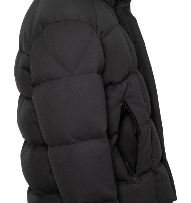 Image 4 of 4 - BLACK - A forward-looking design, the Moncler Karakorum is crafted from elastic technical jersey. Originally designed in 1954 for the first expedition to K2, Moncler Karakorum is created to withstand the harshest climates: the hood, zipper, and double button closure are there to keep you as warm as possible. Internal suspenders allow you to carry the down jacket on your back, giving you maximum freedom of movement. The jacket is adorned with a signature patch pocket on the chest, while the ba 