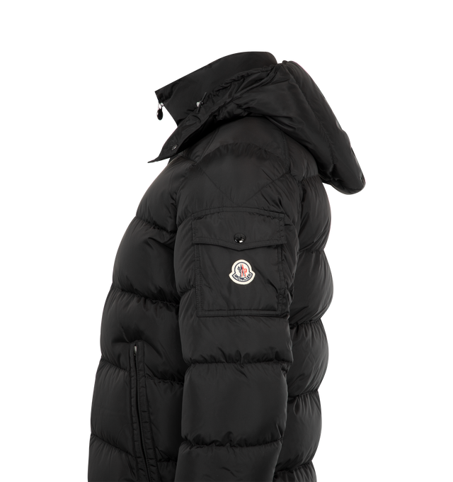Image 3 of 4 - BLACK - MONCLER Maya Jacket featuring nylon lger lining, down-filled, detachable and adjustable hood, zipper and snap button closure, zipped pockets, patch pocket with snap button closure on the sleeve and adjustable hem with drawstring fastening. 100% polyamide/nylon. Padding: 90% down, 10% feather. 
