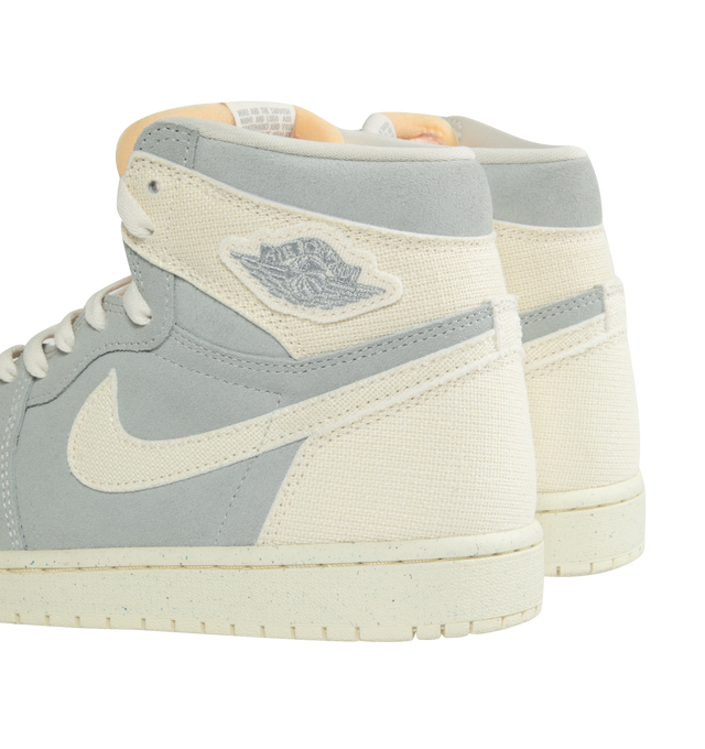 Image 3 of 5 - MULTI - NIKE AIR JORDAN 1 RETRO HIGH OG CRAFT IVORY features a real and synthetic leather in upper, encapsulated Nike Air unit, rubber in the outsole, wings logo on collar, embroidered Swoosh logo and Jumpman on tongue. 