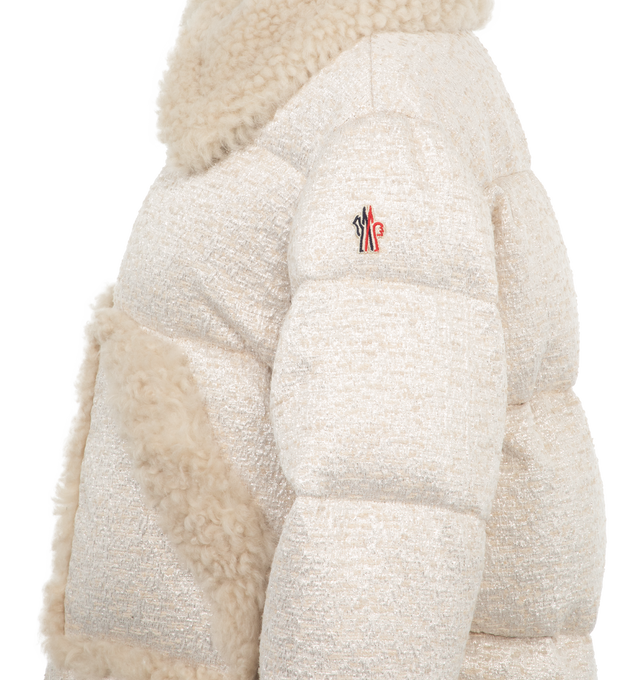 Image 3 of 3 - WHITE - Moncler Grenoble Stowe Jacket has a snap button shearling collar, shearling pocket trim, a zipper closure, interior pockets, a windproof powder skirt, stretch jersey wrist gaiters, and an adjustable hem. Fill 90% down, 10% feathers. Made in Italy.  