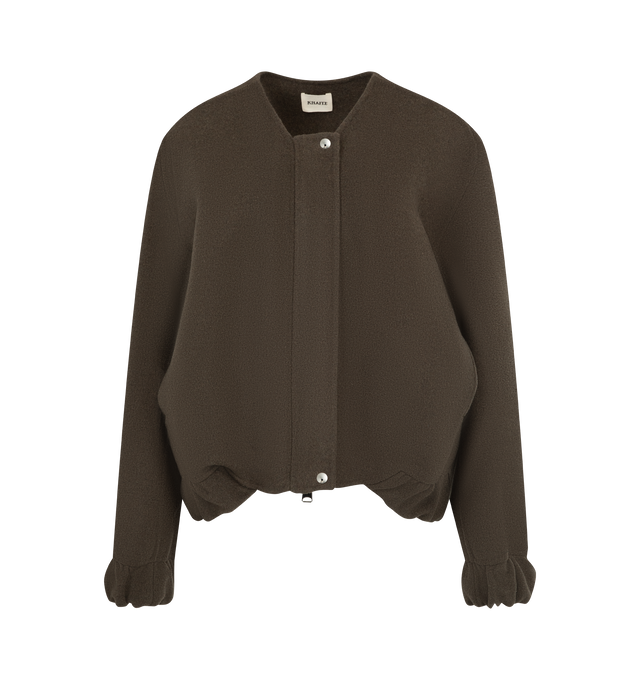Image 1 of 4 - BROWN - Khaite Women's Cordan Jacket is crafted from double-face wool and features a cropped, relaxed bomber silhouette with signature armhole seaming, architectural topstitching, and softly rounded volume. Elasticated panels at the hem and cuffs, in-seam side pockets, and a front zip closure complete this designer wool jacket, combining exceptional craftsmanship with modern, sculptural tailoring for effortless everyday layering. Main Material: 100% Double-Face Wool. 