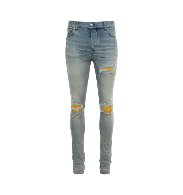 BLUE - AMIRI MX1 Jeans featuring skinny-fit stretch denim, fading, whiskering, and subtle distressing throughout, belt loops, five-pocket styling, button-fly, underlay at front and logo-engraved silver-tone hardware. 92% cotton, 6% elastomultiester, 2% elastane. Made in United States.