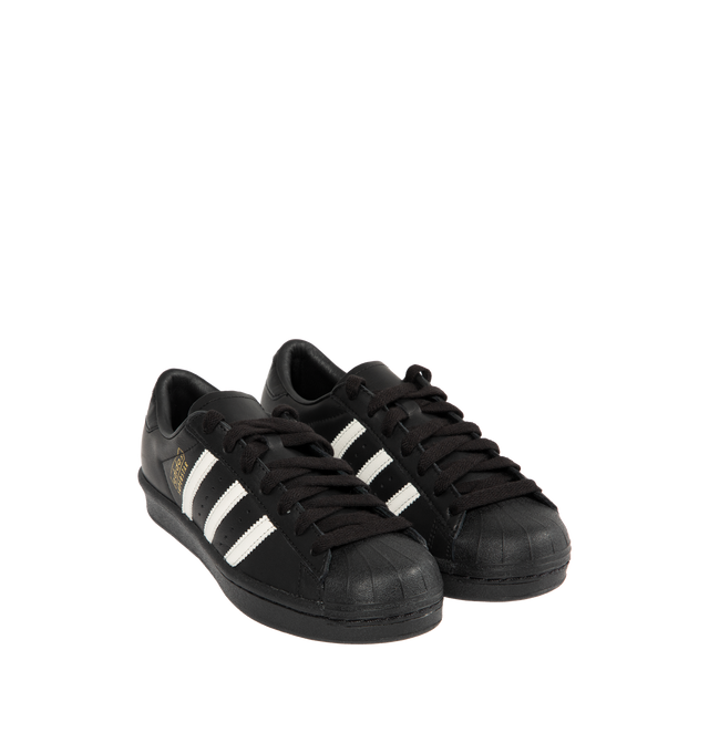 Image 2 of 5 - BLACK - ADIDAS Superstar Vintage Sneakers featuring a shell toe, 3-Stripes on side, heel tab, leather upper, lining and insole and rubber outsole. 