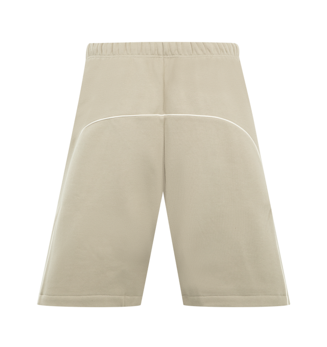 Image 2 of 3 - NEUTRAL - FEAR OF GOD ESSENTIALS Active Trace Relaxed Short featuring drawstring waistband, rubberized logo patch, side seam pockets, embroidered logo and fleece lining. 80% cotton, 20% polyester. 