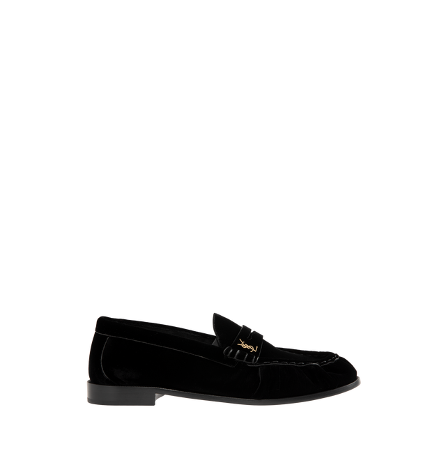 Image 1 of 4 - BLACK - Saint Laurent Men's Cassandre Velvet Penny Loafers are crafted from plush velvet and feature a supple silhouette with a hand-stitched moc toe for a refined finish. Designed with a classic penny loafer profile, these designer shoes are accented with the signature Cassandre in gold-tone brass hardware and finished with a leather sole and low stacked heel. Main Material: Velvet. Hardware: Brass. Sole: Leather. Heel Height: 1.5 cm / 0.6 in. Details: Gold-Tone Cassandre Hardware, Hand-Stit 