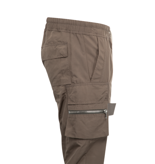 Image 3 of 3 - BROWN - RICK OWENS Mastodon Cargo Pant featuring slim-fit, zippered cargo flap pockets, tabs on the outer thigh, signature elongated drawstrings, elasticized waist and pulls on. 97% cotton, 3% elastane. Made in Italy. 