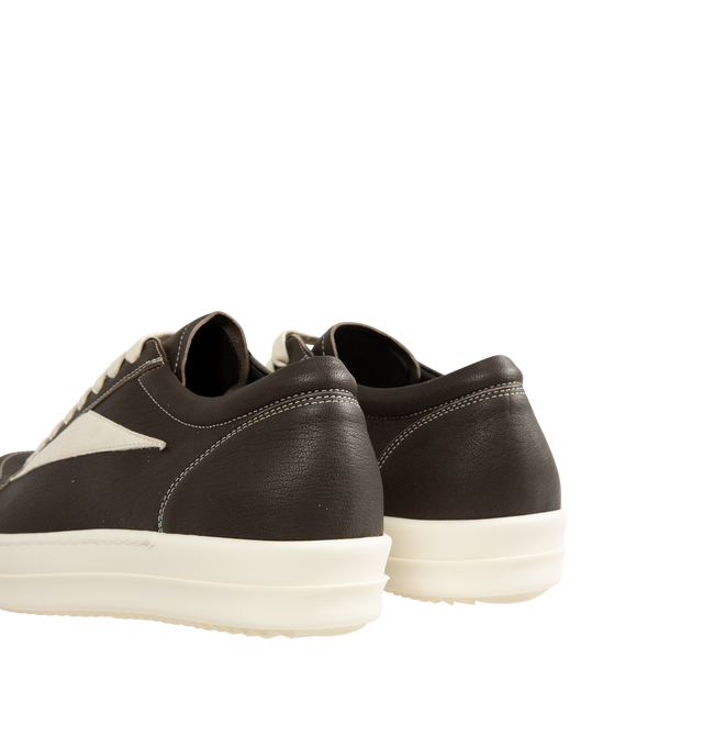 Image 3 of 5 - NEUTRAL - Rick Owens Men's Vintage Sneaks are crafted from full-grain cow leather and suede leather and feature an under-ankle silhouette with eight-eyelet lace-up fastening, toe caps, and signature shark-toothed bumper soles. Designed with a triangular leather appliqu at the side, a padded ankle, and contrast stitching that references the brand's iconic vintage-inspired sneaker aesthetic. Main Material: 100% Cow Leather. Lateral Details: 100% Calf Leather. Lining: 100% Calf Leather. Insole:  