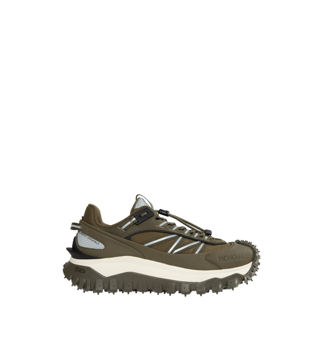 GREEN - MONCLER Trailgrip Sneakers featuring nubuck upper, mesh insole, lace closure, TPU spoiler, EVA midsole, carbon fiber between midsole and tread, vibram MEGAGRIP tread and ortholite insert. Sole height: 4.5 cm. 100% polyester. Lining: 100% polyamide/nylon. Sole: 100% elastodiene. Made in Vietnam. 
