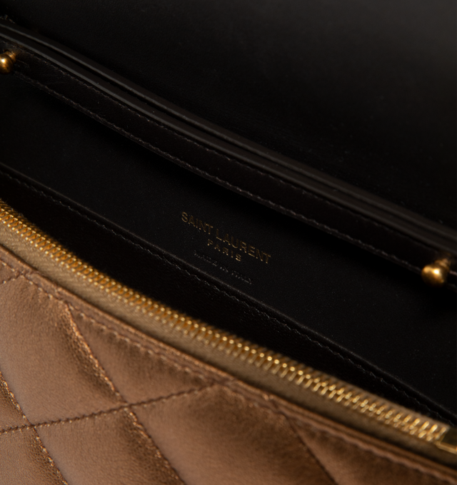 Image 4 of 4 - GOLD - Saint Laurent Women's Envelope Small YSL Wallet on Chain is crafted from metallic leather and features the house's iconic chevron quilting, a signature Cassandre logo, and a detachable leather-and-chain shoulder strap for versatile styling. This designer wallet on chain combines timeless elegance with everyday functionality, offering an envelope flap with snap closure, an interior zip pocket, and a slip pocket for organized essentials. Main Material: Metallic Leather. Hardware: Metal.  