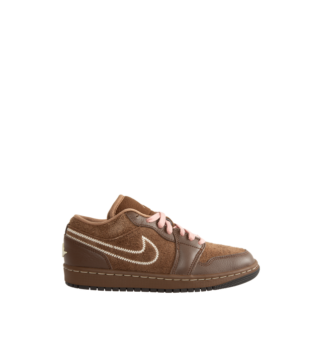 Image 1 of 5 - BROWN - Air Jordan 1 Low SE Women's Shoes pair the timeless design of the original AJ1 with premium materials and everyday comfort. Crafted with a genuine leather upper, this low-top silhouette is designed with Nike Air cushioning and a foam midsole for lightweight support, while a durable rubber outsole provides reliable traction. Main Material: Genuine Leather Upper. Cushioning: Nike Air Technology with Foam Midsole. Outsole: Rubber. 