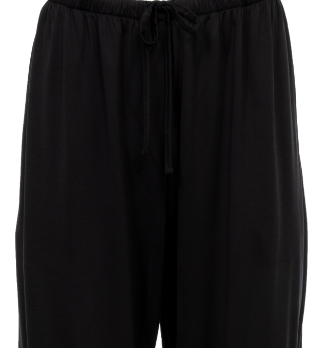 Image 4 of 4 - BLACK - THE ROW Lanuit Pant featuring a mid-rise pull-on pant in smooth silk jersey with relaxed fit, elastic waistband, and side pockets. 100% silk. Made in Italy. 