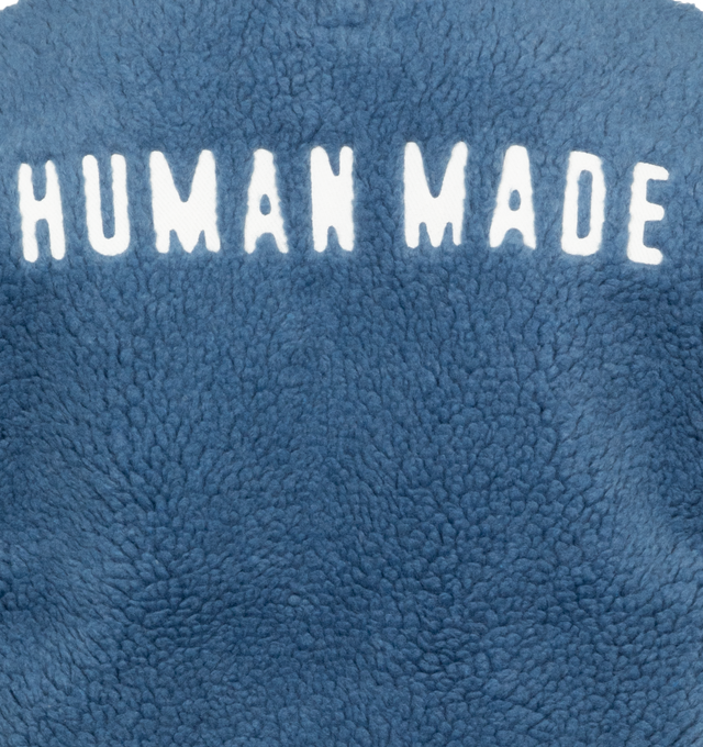 BLUE - HUMAN MADE Boa Fleece Pullover featuring stand collar, 4 button closure, ribbed cuffs and hem, patch logo on chest and logo on back. 