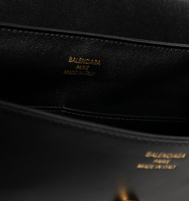 Image 3 of 3 - BLACK - BALENCIAGA Nano Medium Handbag featuring smooth thin calfskin, folded flap corners, one top handle, removable strap, crossbody, shoulder and hand carry, removable cloche cls with one split ring, shiny gold Nano BB logo hardware, studded magnet closure, 1 main compartment, 2 inner flat pocket, back zipped pocket, side snaps and nappa lambskin bonded lining. L11 x H9.8 x W4.7 inch. Made in Italy. 