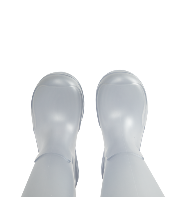 Image 4 of 4 - WHITE - Loewe Women's Storm Boot is crafted from molded transparent PVC and features an oversized Loewe logo at the shaft with a distinctive wavy-pattern rubber outsole. Designed in a sleek pull-on silhouette, the boot combines statement branding with durable all-weather construction. Main Material: PVC. Heel Height: 2 cm (20 mm). Made in Italy. 
