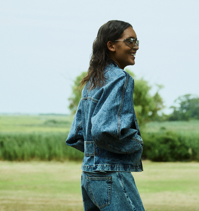 Image 3 of 4 - BLUE - ALAIA Denim Zip-Up Jacket with Rounded Sleeves featuring belted detailing at the back, band collar, long sleeves, side slip pockets, hip length and relaxed fit. Cotton/polyurethane. Made in Italy. 