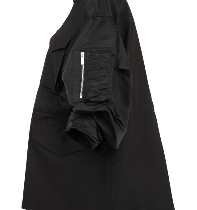 Image 3 of 4 - BLACK - Sacai oversized jacket in cotton weather cloth featuring nylon twill sleeve panels, high stand collar with zipper detail, concealed front closure, flap pockets at the chest and waist, and a sleeve zip pocket. Outer fabric is 100% cotton with 100% nylon sleeves and 100% polyester lining and fill. Made in Japan. 