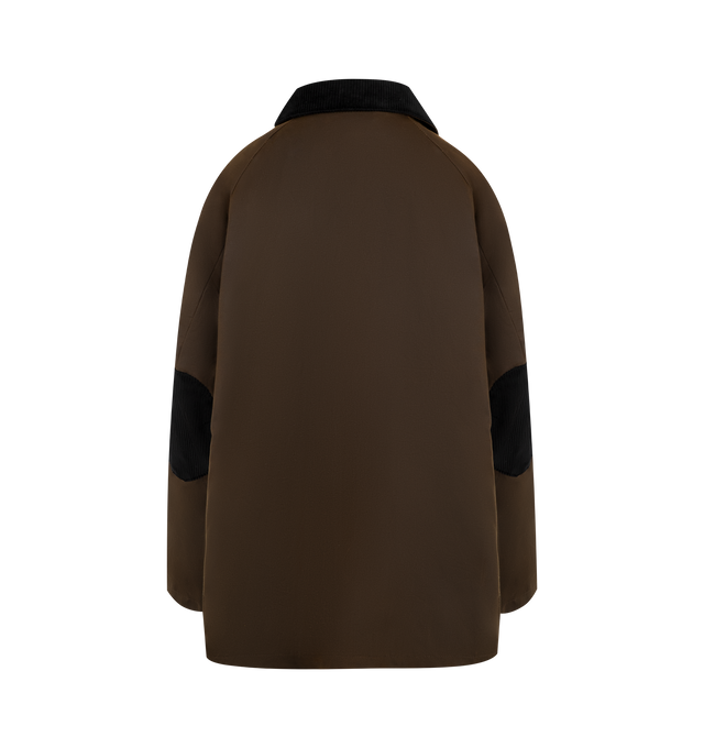 Image 2 of 3 - BROWN - Toteme oversized jacket made from waxed cotton sourced from British heritage weavers and dyed in a new brown shade named bark. It has a very spacious A-line silhouette accented with a black corduroy collar and elbow patches, a zipper and press-stud front, multiple front pockets, and two back vents. 100% cotton organic; lining: 100% viscose; filling: 100% polyester. Made in Romania. 