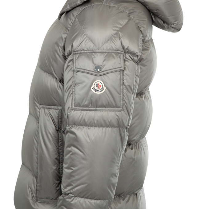 Image 3 of 4 - GREY - MONCLER Couyere Hooded Short Down Jacket featuring micro ripstop lining, down-filled, detachable and adjustable hood, zipper closure, zipped pockets, sleeve pocket with snap button closure, elastic cuffs and hem with drawstring fastening.  100% polyamide/nylon. Padding: 90% down, 10% feather. Made in Italy 