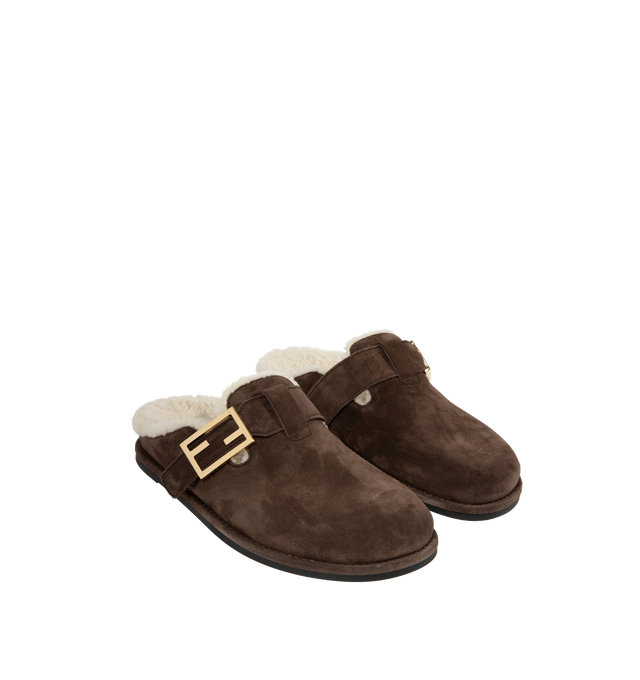 Image 2 of 4 - BROWN - FENDI Feel Mules featuring round-toed sabots with FF strap, suede, finished with white sheepskin interior and gold-finish metalware. Made in Italy. 