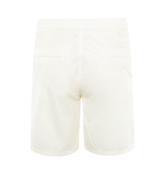 Image 2 of 3 - WHITE - STONE ISLAND Ghost Swim Shorts featuring comfort fit, slanted hand pockets, two back pockets with hidden zipper closure, tone-on-tone Stone Island lettering print on left leg, side vents on the bottom hems, inner mesh, elasticized waistband with inner drawstring and zipper and button fly closure. 100% polyamide/nylon. 