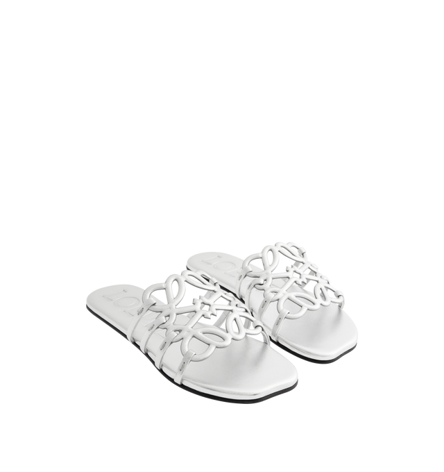 Image 2 of 4 - SILVER - LOEWE Petal Anagram Slide in laminated lambskin featuring a cut-out Anagram upper with hand-painted edges and hand-stitched seams, 5mm heel, embossed LOEWE on the insole, padded leather insole, rubber-injected island on the outsole and hand-stitched seams. Laminated lambskin. Made in Italy. 