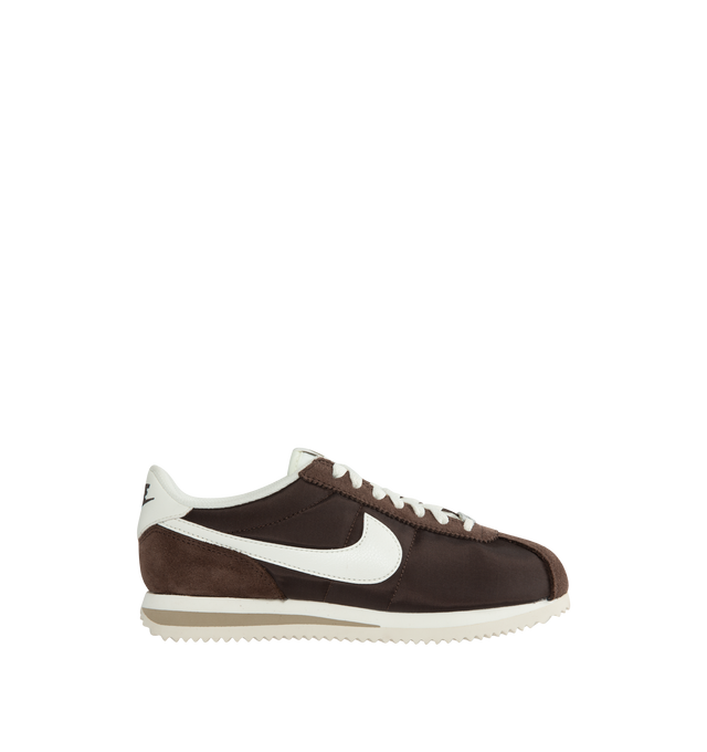 BROWN - NIKE Cortez Sneaker featuring eengineered padded, low-cut collar, wider toe box, firmer side panels, foam midsole with iconic wedge insert and herringbone outsole.