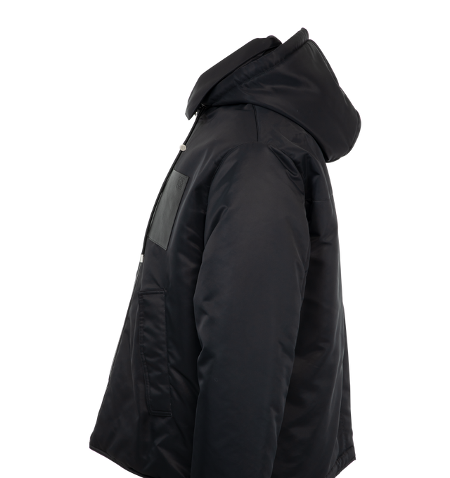 Image 3 of 3 - BLACK - Loewe Hooded jacket in compact nylon twill featuring a padded construction, a hooded collar with a leather drawstring and an adjustable drawstring hem. Regular fit and regular length with zip front fastening, buttoned flap pockets, inside welt pocket with LOEWE Anagram embroidery and Anagram embossed leather chest patch pocket. Fully lined. Main material: Polyamide. Made in Portugal. 