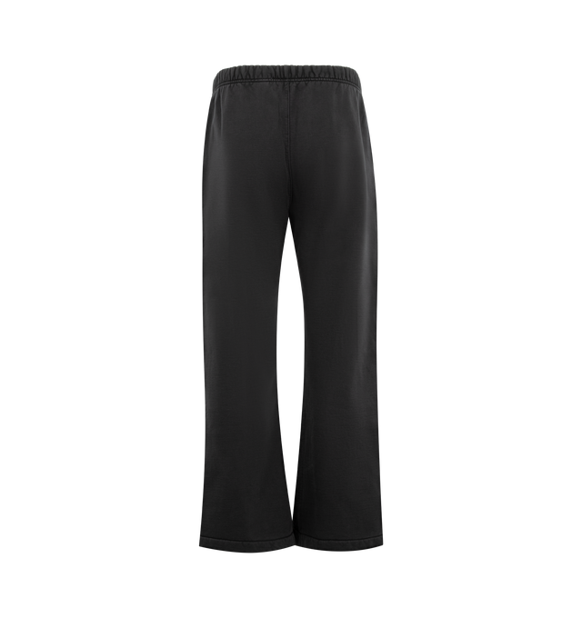 Image 2 of 3 - BLACK - FEAR OF GOD ESSENTIALS Signature Classic Flare Sweatpant featuring 520GSM heavyweight fleece, pigment-dyed, relaxed silhouette, flared leg, an encased elastic waistband with elongated drawcords, side-seam pockets, Essentials signature logo embroidered on the leg and an Essentials signature label at the center front. 100% cotton. 