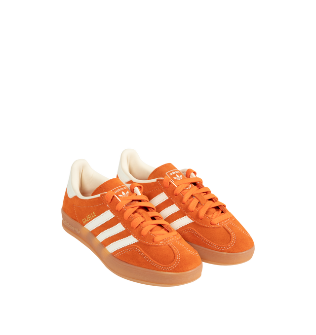 Image 2 of 5 - ORANGE - Adidas Gazelle Indoor Sneakers are a lace-up style with suede uppers and gum outsoles. Textile linings. Unisex style in men's sizes. 