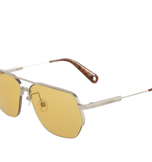 Image 3 of 3 - SILVER - Jacquemus Aviador Sunglasses offer hexagonal silver tone metal frames with eyewear chain compatible tips, yellow lenses, brand logos at the temples, stainless steel tips, and silver-tone metal details 100% acetate frames. Made in Japan.  