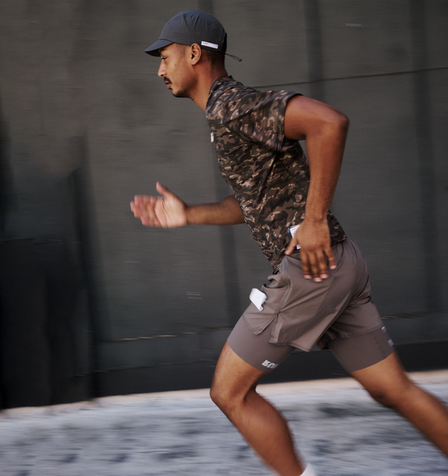 Image 5 of 5 - MULTI - Satisfy Men's Space-O Shell Running Top is crafted from lightweight Space-O perforated micro jersey and features precision-punched openings for exceptional breathability. Designed with a regular fit, the four-way stretch construction moves naturally with the body, while fast-drying performance supports long-distance and high-intensity efforts. Finished with an exterior detachable care label for distraction-free comfort. Main Material: Space-O 73% nylon, 27% elastane.  
