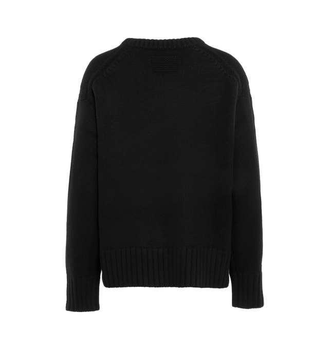 Image 2 of 3 - BLACK - GUEST IN RESIDENCE Cozy Crew featuring oversized fit, crew neck, dropped shoulder, reverse jersey detail around arm & shoulder with tuck stitch, ribbed neck trim, cuff and hem, side slit at hem and jersey cable. 100% cashmere.  