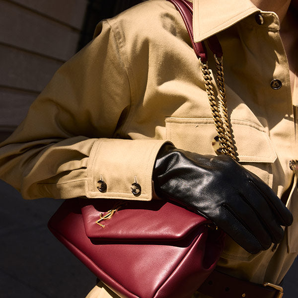 Saint Laurent khaki twill jumpsuit and burgundy leather Calypso shoulder bag with chain strap