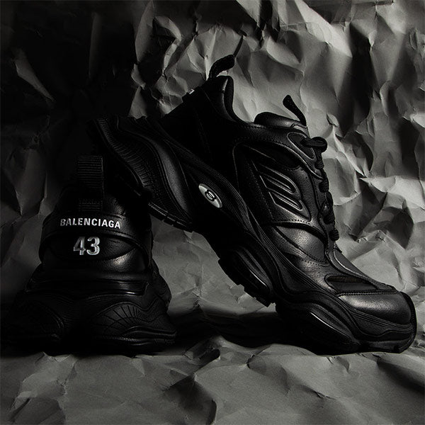 BALENCIAGA Cargo Sneaker featuring oversized volume, worn-out effect, black microfiber and mesh